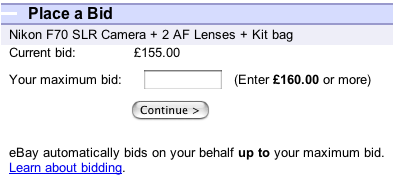 Placing a bid on eBay. Part of the page reads- Place a bid / Nikon F70 SLR Camera+2 AF Lenses+Kit bag / Current bid- £155.00 / Your maximum bid- [text entry field] (Enter £160.00 or more) / Continue [button] / eBay automatically bids on your behalf up to your maximum bid. / Learn about bidding.